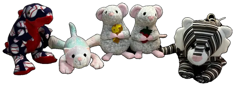 Handmade stuffed animals sitting in a row